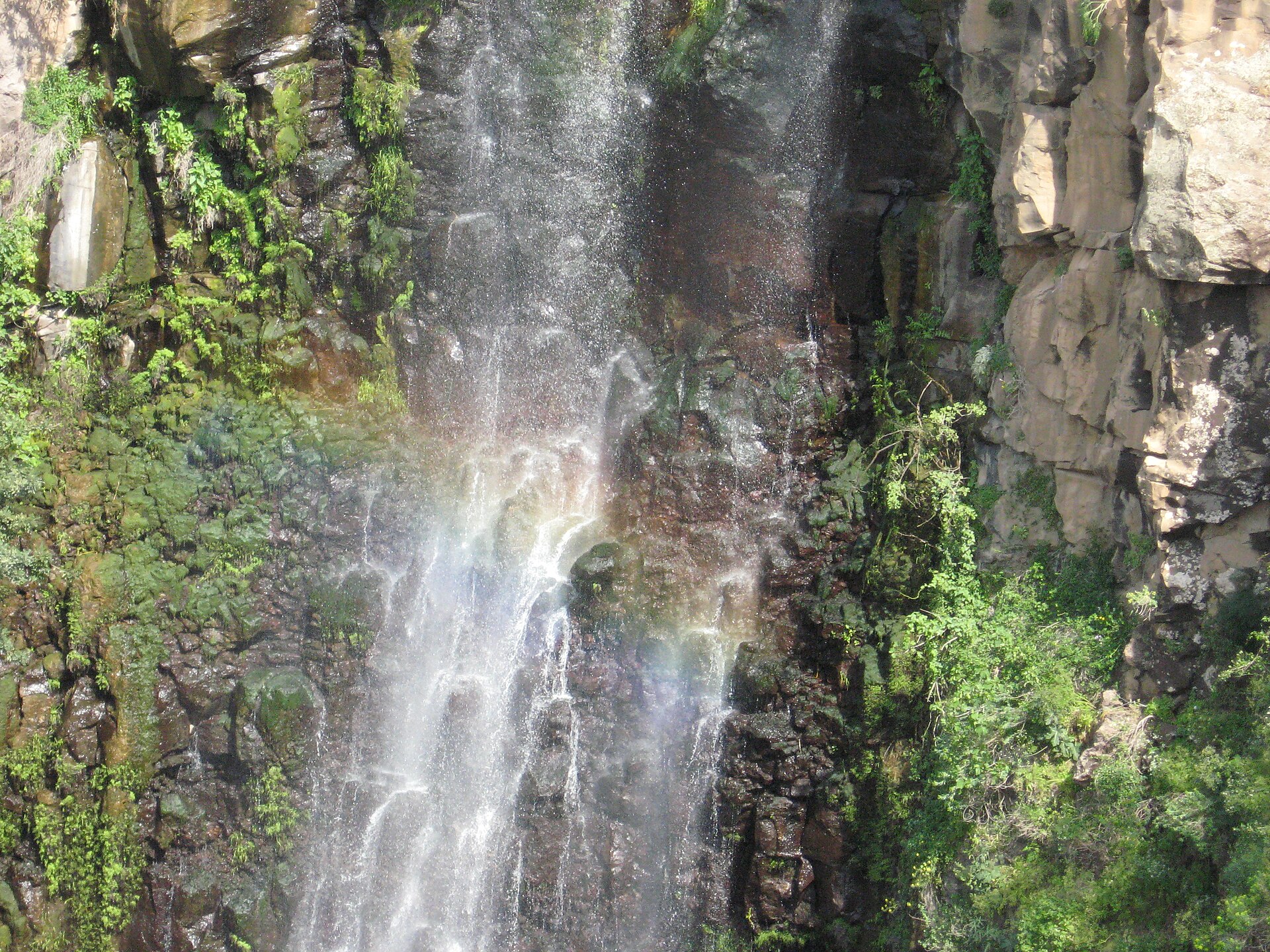 Gilbon River waterfall rainbow close-up.jpg